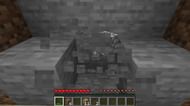 Mining stone blocks in Minecraft. (Image via Minecraft)